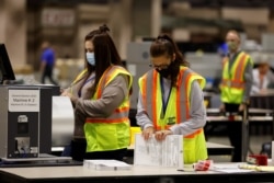 Votes are counted at the Pennsylvania Convention Center on Election Day in Philadelphia, Pennsylvania, Nov. 3, 2020.