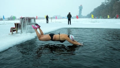 People in China Swim in Freezing River for Health, Happiness