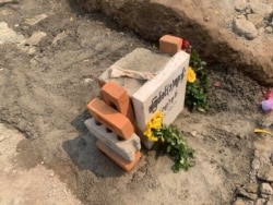 A grave of 19-year-old protester, Kyal Sin, is pictured  in Mandalay, after Myanmar authorities exhumed her body, Match 6, 2021, in this picture obtained from social media.