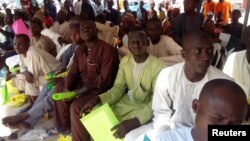 Young men who were released from the ranks of a militia group fighting against the Islamist militant group Boko Haram are pictured during a handover ceremony in Maiduguri, Nigeria, Oct. 12, 2018. 