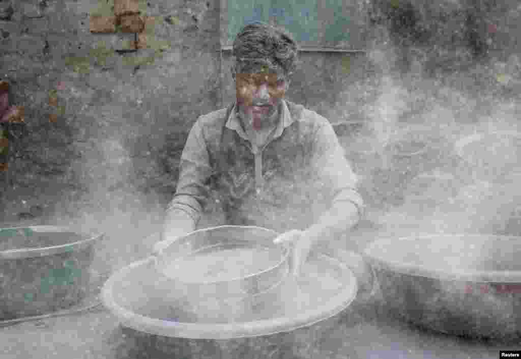 A worker prepares gunpowder to make firecrackers at a factory ahead of Diwali, the Hindu festival of lights, on the outskirts of Ahmedabad, India.