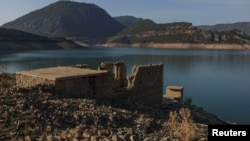 The images shows the reappearing remains of buildings of the village of Kallio, which was intentionally flooded in 1980 to create a reservoir to supply water needs of Greek's capital Athens on September 3, 2024.(REUTERS/Stelios Misinas)