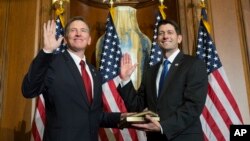 House Speaker Paul Ryan of Wisconsin administers the House oath of office to Rep. Paul Gosar, R-Ariz., during a mock swearing in ceremony on Capitol Hill in Washington, Jan. 3, 2017.