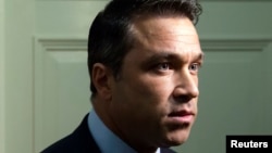 U.S. Representative Michael Grimm talks to reporters outside his office on Capitol Hill in Washington, April 29, 2014.