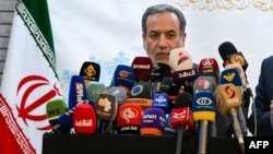 Iranian Foreign Minister Abbas Araghchi speaks to the press after meeting with Syrian officials at the Iranian embassy in Damascus, Syria, on Oct. 5, 2024.