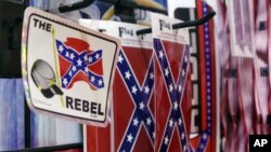 FILE - Confederate flag-themed stickers are displayed at Arkansas Flag and Banner in Little Rock, Ark., Tuesday, June 23, 2015.