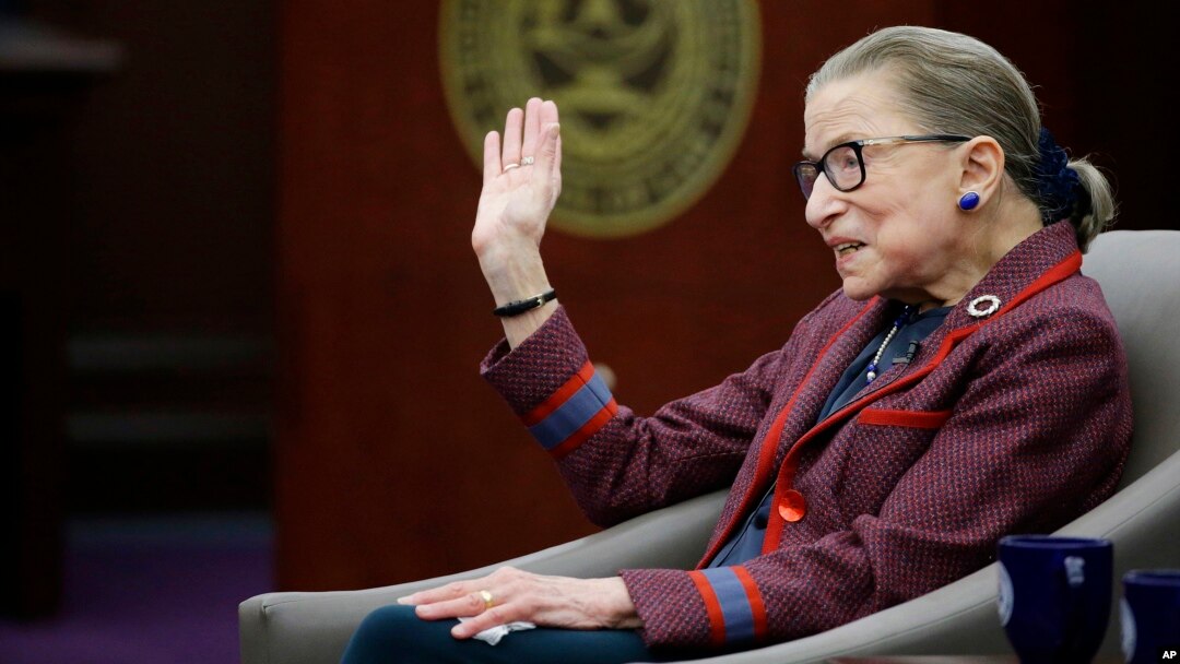 Supreme Court Justice Ruth Bader Ginsburg waves goodbye to those who came to listen and participate in her "fireside chat" in the Bruce M. Selya Appellate Courtroom at the Roger William University Law School in Bristol, Rhode Island, Jan. 30, 2018.