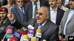 Yemeni President Ali Abdullah Saleh reacts while delivering a speech to his supporters, during a rally in his support in Sana'a, May 20, 2011