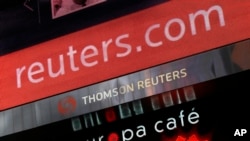 FILE - The logo of Thomson Reuters is shown on its building in New York, Jan. 19, 2010. 