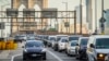 FILE - Traffic enters lower Manhattan after crossing the Brooklyn Bridge, Feb. 8, 2024, in New York. New York’s new toll for drivers entering the center of Manhattan debuted on Jan. 5, 2025.