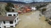 Homes are flooded by the overflowing Pasajahuira River in La Paz, Bolivia, Nov. 24, 2024.