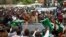 
FILE: Then-Patriotic Front (PF) Presidential candidate Edgar Lungu and his wife Esther Lungu leave a rally in Lusaka January 19, 2015. 