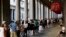 FILE - People line up to enter the Uffizi Gallery in Florence, Italy, Aug. 1, 2017.