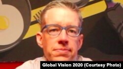 J. Kevin White wearing his glasses. White has developed a system to provide eye testing and glasses to people in developing nations.