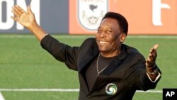 FILE - Brazilian soccer legend Pele waves to the crowd during a pregame ceremony before an NASL soccer game in Hempstead, New York, Aug. 3, 2013. 