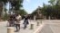 FILE - Students near the front gate of National Taiwan University.
