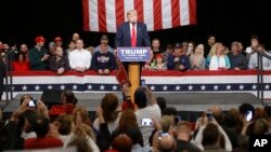 FILE - Republican presidential candidate Donald Trump speaks during a campaign stop in North Charleston, S.C., Feb. 19, 2016. 