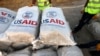 (FILES) Airport personnel check humanitarian aid supplies after 60 tons of aid from USAID were unloaded from a plane at the airport in Arbil, the capital of the autonomous Kurdish region of northern Iraq, on September 2, 2014.