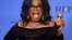 Oprah Winfrey poses in the press room with the Cecil B. DeMille Award at the 75th annual Golden Globe Awards Jan. 7, 2018, in Beverly Hills, Calif. 