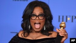 Oprah Winfrey poses in the press room with the Cecil B. DeMille Award at the 75th annual Golden Globe Awards at the Beverly Hilton Hotel on Jan. 7, 2018, in Beverly Hills, California. 