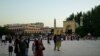 FILE - Uyghur people pass outside the Id Kah Mosque in Kashgar, China, on July 13, 2023. International delegates of the Organization of Islamic Cooperation praised Xinjiang's "prosperity and development” when they visited cities such as Kashgar in August 2023.