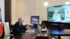 Russian President Vladimir Putin attends a meeting with head of the Central Election Commission Ella Pamfilova, via a video conference call at the Novo-Ogaryovo state residence outside Moscow, Sept. 20, 2021. (Sputnik/Alexei Druzhinin/Kremlin via Reuters)