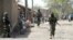 Nigerian soldiers are seen patrolling a town in the north-eastern state of Borno in this April 30, 2013, file photo.