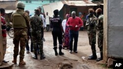 Security men stand guard in front of a polling station during the presidential elections in Bamako, Mali, July 29, 2018.