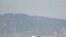 한국 해병대가 20일 서북도서 지역에서 해상 사격훈련을 실시한 가운데, 사격종료 후 연평도 주변을 순찰하는 해군 보트.