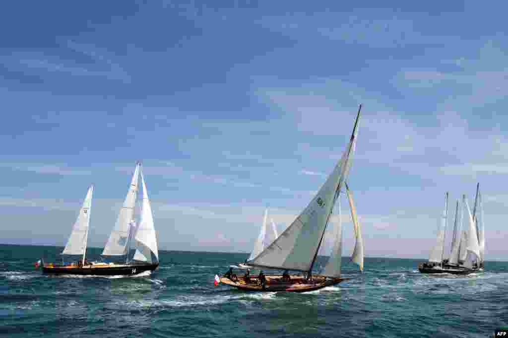 Pen Duick ocean racing yachts sail off the coast of Saint-Quay-Portrieux, western France during a trip at sea from Roscoff to Saint-Quay-Portrieux.