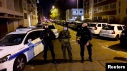 Police secures a street after a Greek Orthodox priest was shot and injured at a church in the center of Lyon, France, Oct. 31, 2020. 