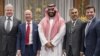 An alternative crop from a file handout picture released by the Saudi Royal Palace on November 9, 2016 shows Saudi Arabia's Crown Prince Mohammed bin Salman (C) posing for a picture with Amazon chief, Jeff Bezos (2nd L)