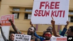 FILE - Supporters of Afrobeat star Seun Kuti protest and demand for his release outside the Magistrate court in Lagos, Nigeria, Tuesday, May 23, 2023.