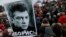 People gather in St. Petersburg, Russia, to commemorate the 2015 slaying of opposition leader Boris Nemtsov, Feb. 27, 2016.