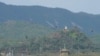 FILE - A North Korean loudspeaker, top left, a military guard post, top right, and a South Korean military guard post, bottom, are seen from Paju, South Korea, near the border with North Korea, Oct. 10, 2024. 