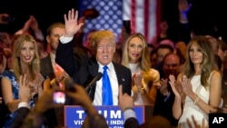 Republican presidential candidate Donald Trump is joined by his wife Melania, right, daughter Ivanka, left, as he speaks during a primary night news conference, Tuesday, May 3, 2016, in New York. (AP Photo/Mary Altaffer)