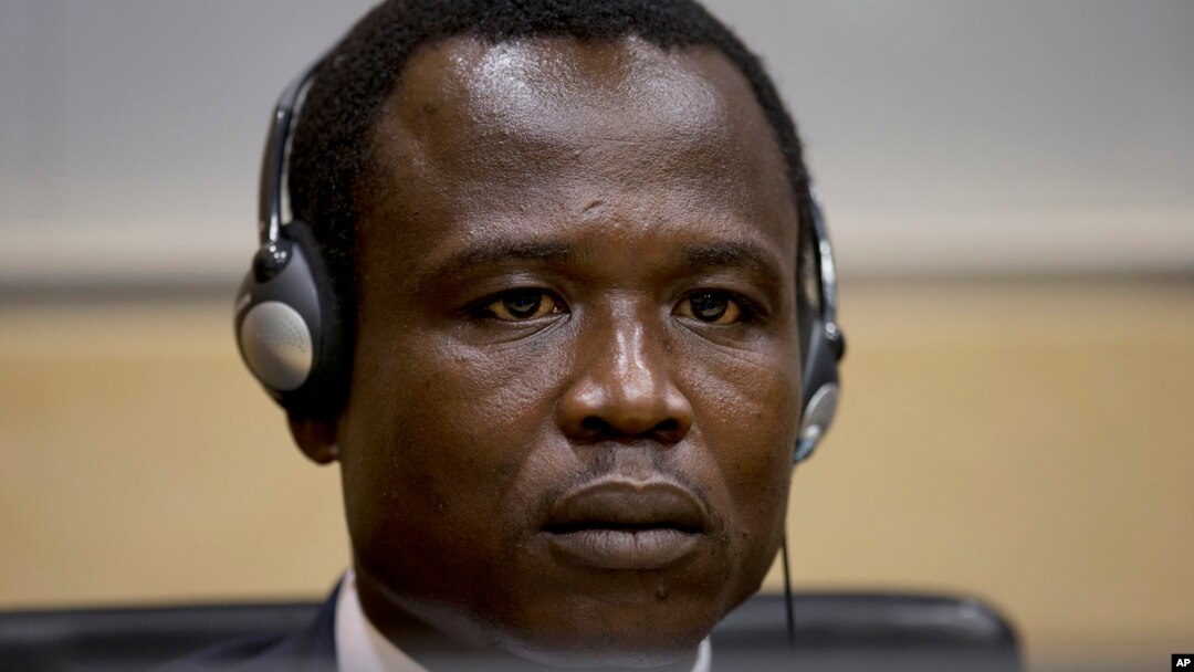 Dominic Ongwen, a Ugandan commander in warlord Joseph Kony's feared militia, waits for the judge to arrive as he made his first appearance at the International Criminal Court in The Hague, Netherlands, Jan. 26, 2015.