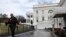 FILE - A Secret Service police officer walks past the White House, in Washington, March 22, 2019.