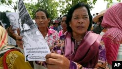 Farmers from some of provinces stage a protest rally near prime minister's residence in Phnom Penh, Cambodia, Monday, July 22, 2019. (AP Photo/Heng Sinith)