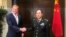 Acting U.S. Defense Secretary Patrick Shanahan and Chinese Defense Minister Wei Fenghe meet before the start of their meeting in Singapore on the sidelines of the Shangri-La dialogue, May 31, 2019. 