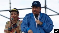 Nicaragua’s President Daniel Ortega speaks to supporters as his wife and Vice President Rosario Murillo applauds, in Managua, Nicaragua, Aug. 29, 2018. 