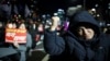 A man gestures as protesters demanding the impeachment of South Korean President Yoon Suk Yeol, who declared martial law, which was reversed hours later, gather in front of the National Assembly in Seoul, Dec. 6, 2024. 