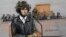A courtroom sketch depicts Boston Marathon bombing suspect Dzhokhar Tsarnaev sitting in federal court in Boston, Massachusetts, Dec. 18, 2014, for a final hearing before his trial begins in January.