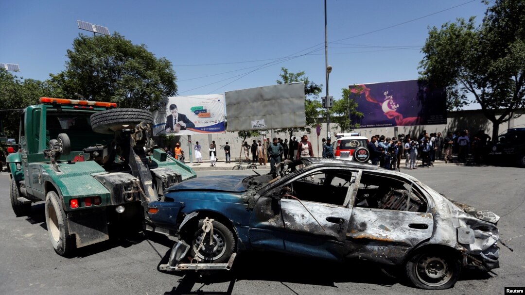 A damaged car is moved away after a blast in Kabul, Afghanistan May 31, 2017. 