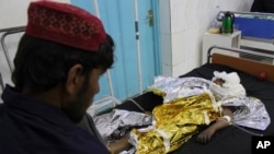 An injured boy receives treatment at a hospital after an airstrike in Helmand province, southern Afghanistan, Nov. 28, 2018. Civilians and Taliban fighters were killed in the strike as Afghan government forces battled insurgents.