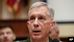 Marine Gen. Thomas Waldhauser speaks before the start of a hearing before the House Armed Services Committee on Capitol Hill in Washington, March 6, 2018, about "National Security Challenges and U.S. Military Activities in Africa."