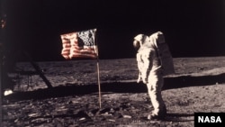 Astronaut Edwin E. "Buzz" Aldrin Jr. poses for a photograph beside the U.S. flag deployed on the moon during the Apollo 11 mission on July 20, 1969. (AP Photo/NASA/Neil A. Armstrong)