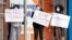 Women hold signs outside housing commission apartments under lockdown in Melbourne, Australia, July 6, 2020. 