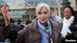 FILE - Jill Stein, 2016 Green Party candidate for U.S. president, holds a rally and protest against stopping the recount of election ballots at Cobo Center in Detroit, Michigan, Dec.10, 2016.