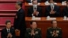 资料照片：中国国家主席习近平2023年3月12日在北京人民大会堂出席全国人民代表大会会议期间，从时任中央军委副主席张又侠和何卫东身旁走过，这两位军委副主席目前都已落马。